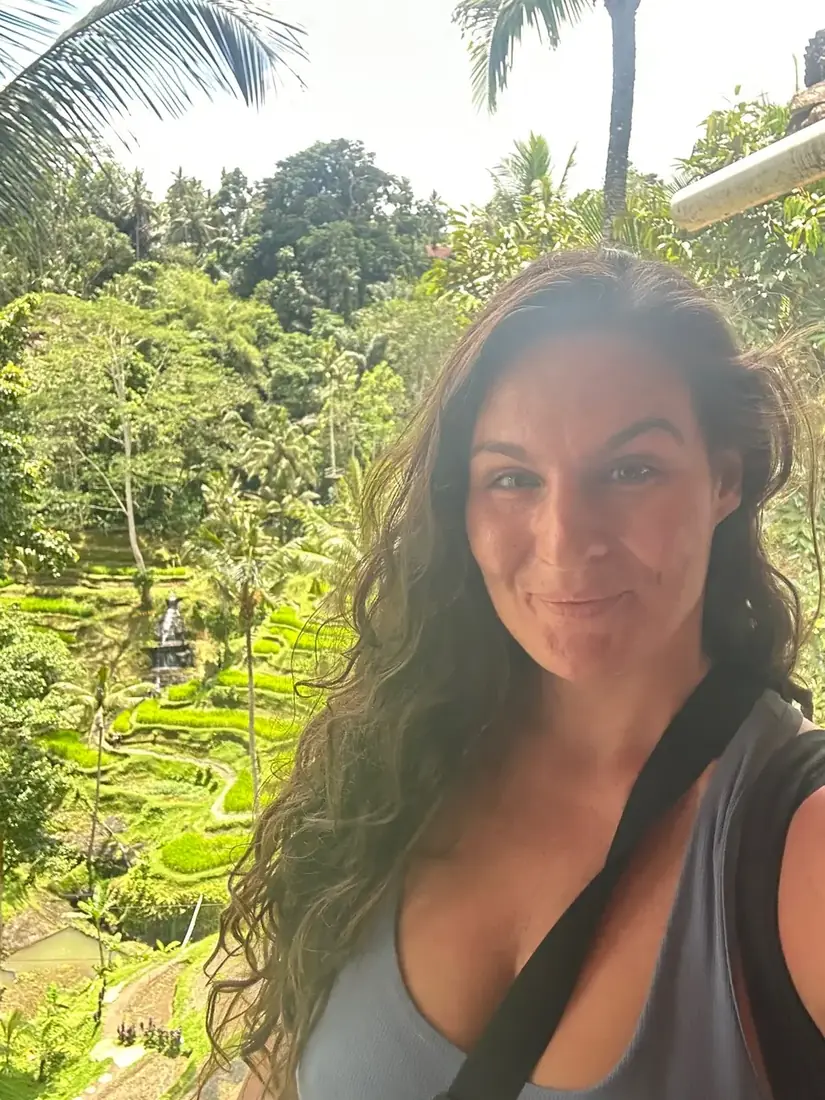 Alana smiling in front of Bali rice terraces